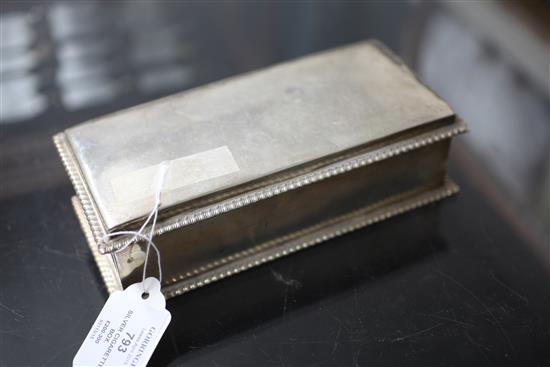 An Edwardian silver mounted cigarette box, 8in.